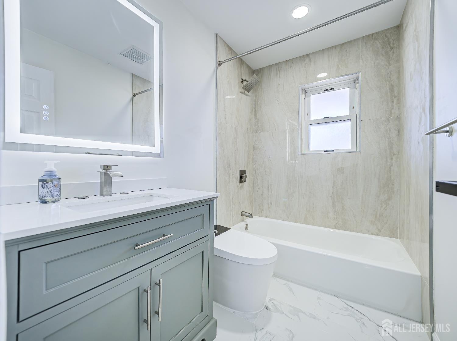 18 Judson Street, Unit 22B Edison, NJ 08837 - Photo 18 of 34 a bathroom with a granite countertop sink a toilet and shower
