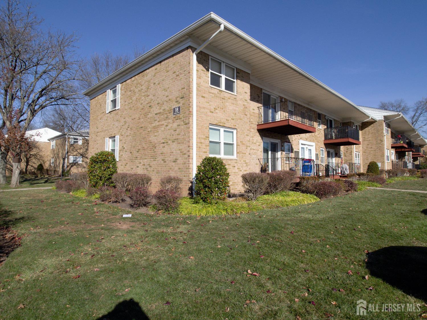 18 Judson Street, Unit 22B Edison, NJ 08837 - Photo 25 of 34 a front view of a house with a yard