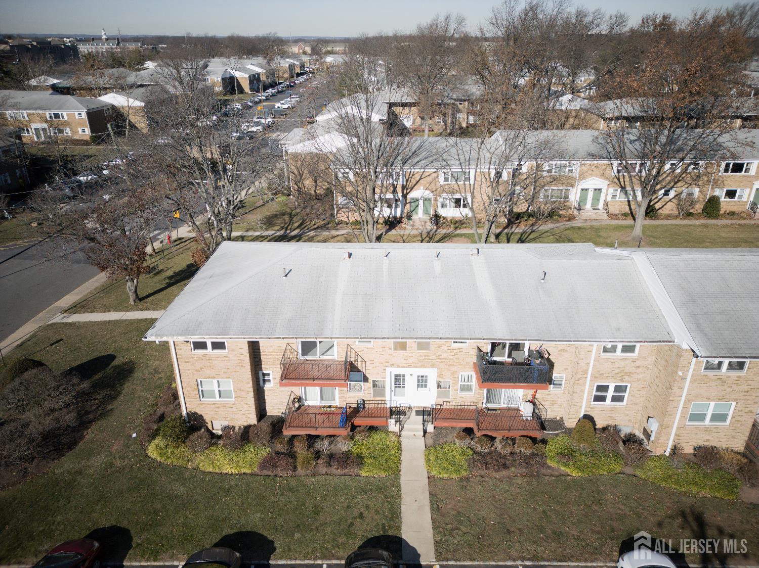 18 Judson Street, Unit 22B Edison, NJ 08837 - Photo 34 of 34 an aerial view of a house with a yard lake and mountain view