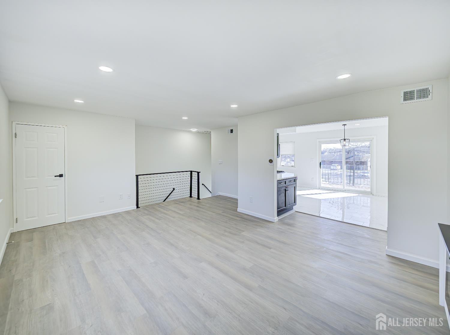 18 Judson Street, Unit 22B Edison, NJ 08837 - Photo 7 of 34 a view of an empty room with wooden floor