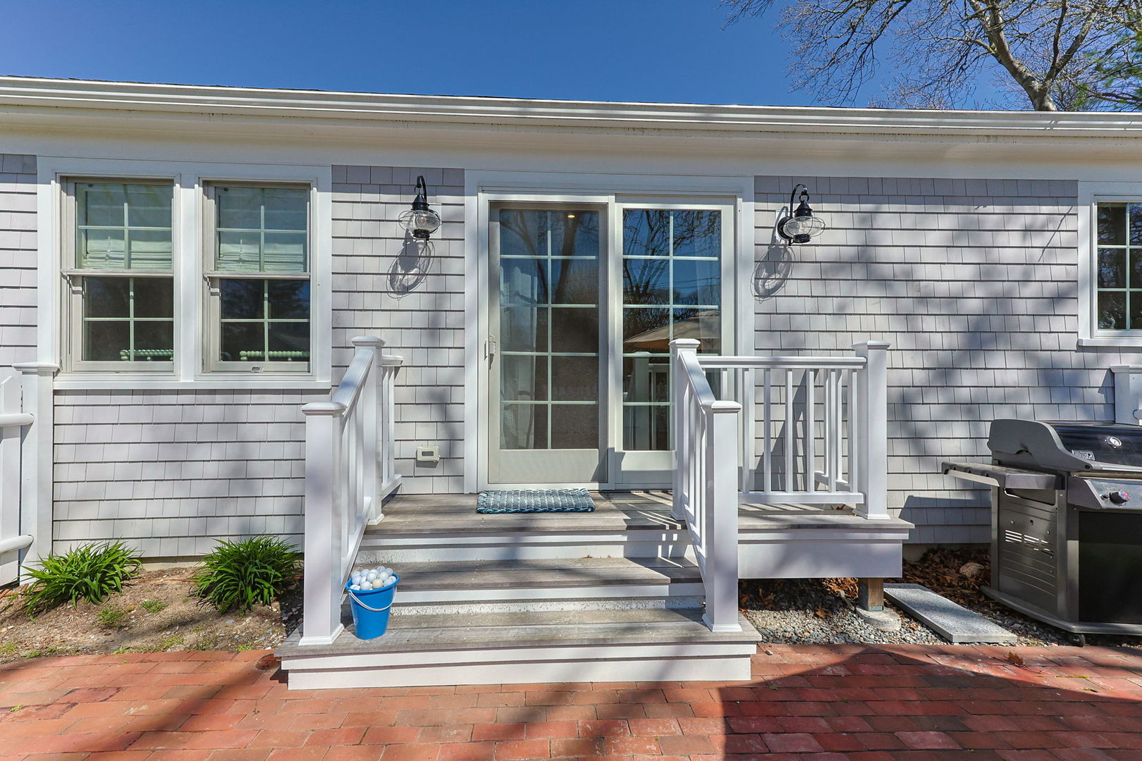 16 2nd Avenue Osterville, MA 02655 - Photo 30 of 49 a front view of a house with a window