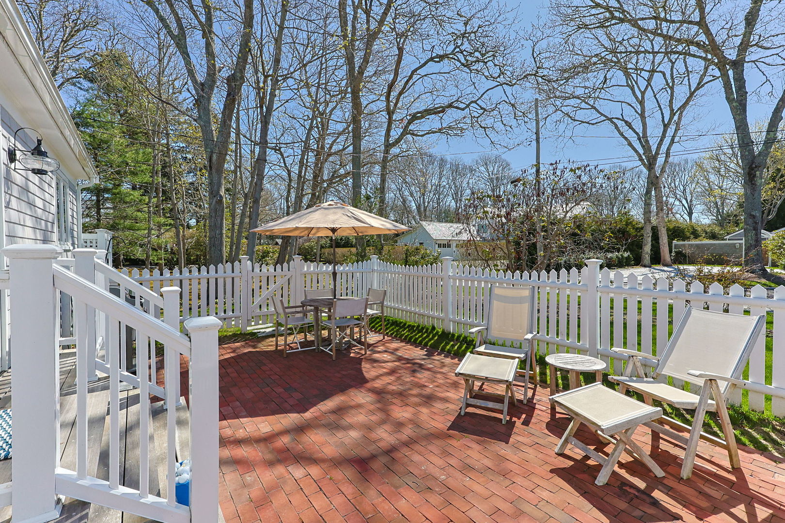 16 2nd Avenue Osterville, MA 02655 - Photo 31 of 49 a view of a chair and tables in the patio
