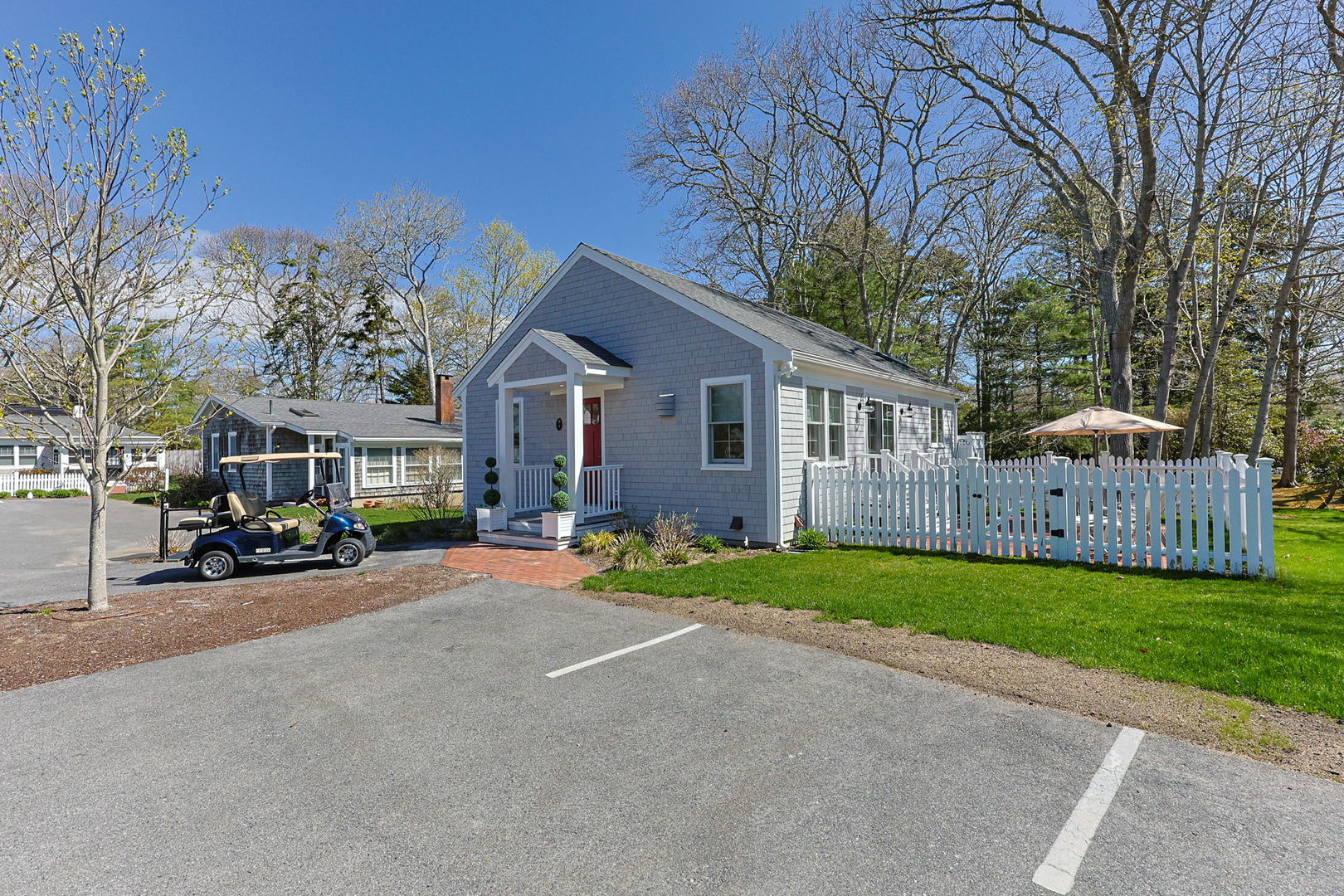 16 2nd Avenue Osterville, MA 02655 - Photo 37 of 49 a view of a house with a patio and a yard