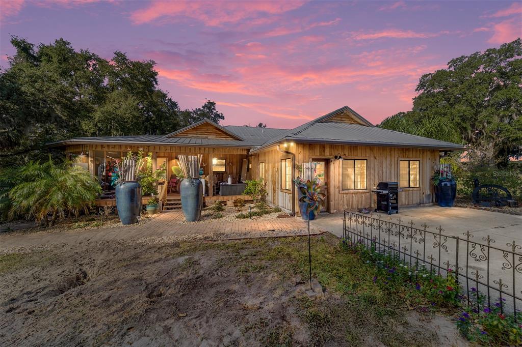 36203 Micro Racetrack Road Fruitland Park, FL 34731 - Photo 25 of 72 a view of a house with patio and wooden fence