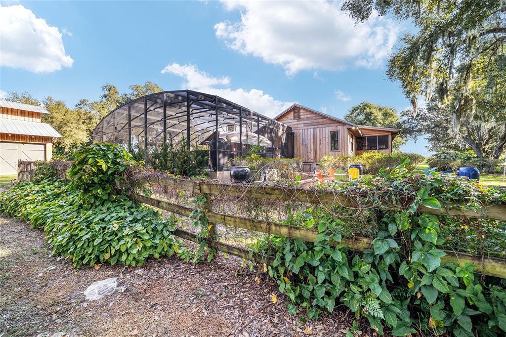 36203 Micro Racetrack Road Fruitland Park, FL 34731 - Photo 33 of 72 a view of a house with a yard and plants