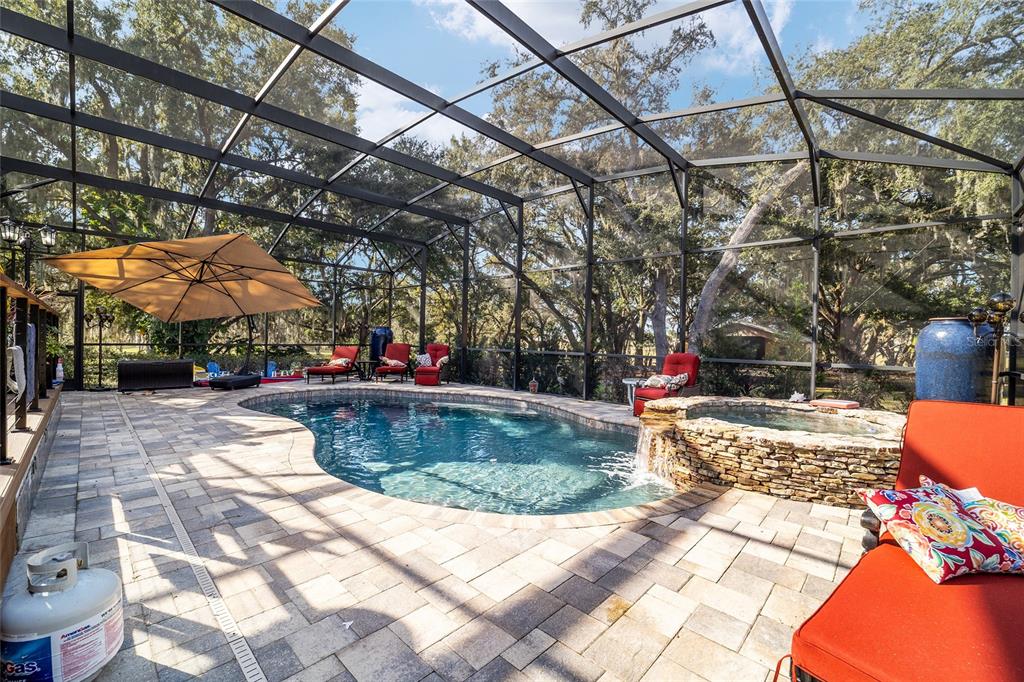 36203 Micro Racetrack Road Fruitland Park, FL 34731 - Photo 58 of 72 a view of a swimming pool with a patio