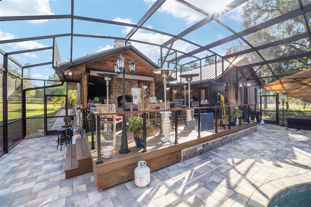 36203 Micro Racetrack Road Fruitland Park, FL 34731 - Photo 61 of 72 a view of a chairs and table in a patio