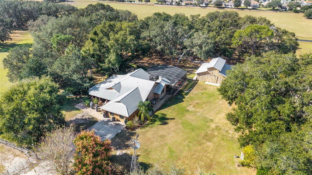 36203 Micro Racetrack Road Fruitland Park, FL 34731 - Photo 68 of 72 an aerial view of a house with swimming pool and outdoor space