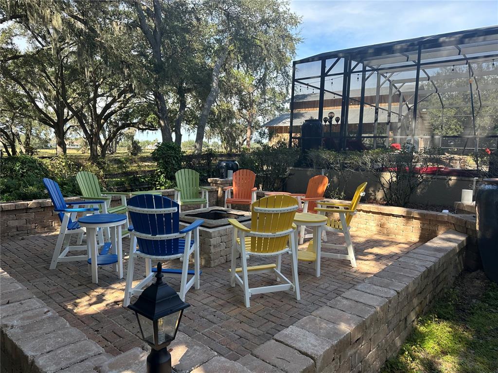 36203 Micro Racetrack Road Fruitland Park, FL 34731 - Photo 10 of 72 a chairs and tables in a patio