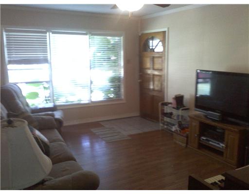 1509 Austin Street Portland, TX 78374 - Photo 2 of 10 a living room with furniture and a flat screen tv
