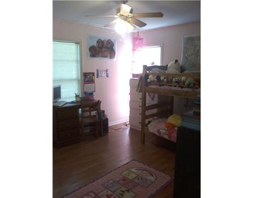 1509 Austin Street Portland, TX 78374 - Photo 6 of 10 a room with furniture and a chandelier