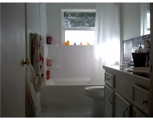 a kitchen with a sink a window and appliances