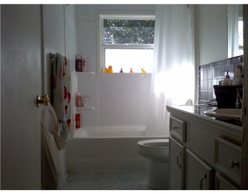 1509 Austin Street Portland, TX 78374 - Photo 7 of 10 a kitchen with a sink a window and appliances