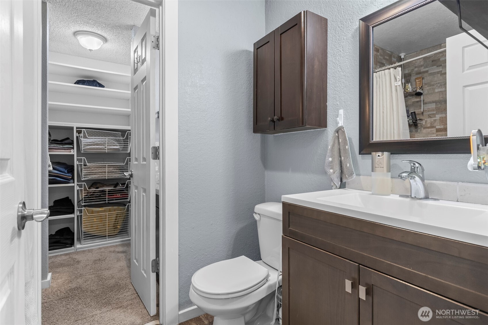 157 South 330th Street, Unit A Federal Way, WA 98003 - Photo 15 of 21 a bathroom with a sink a toilet and shower