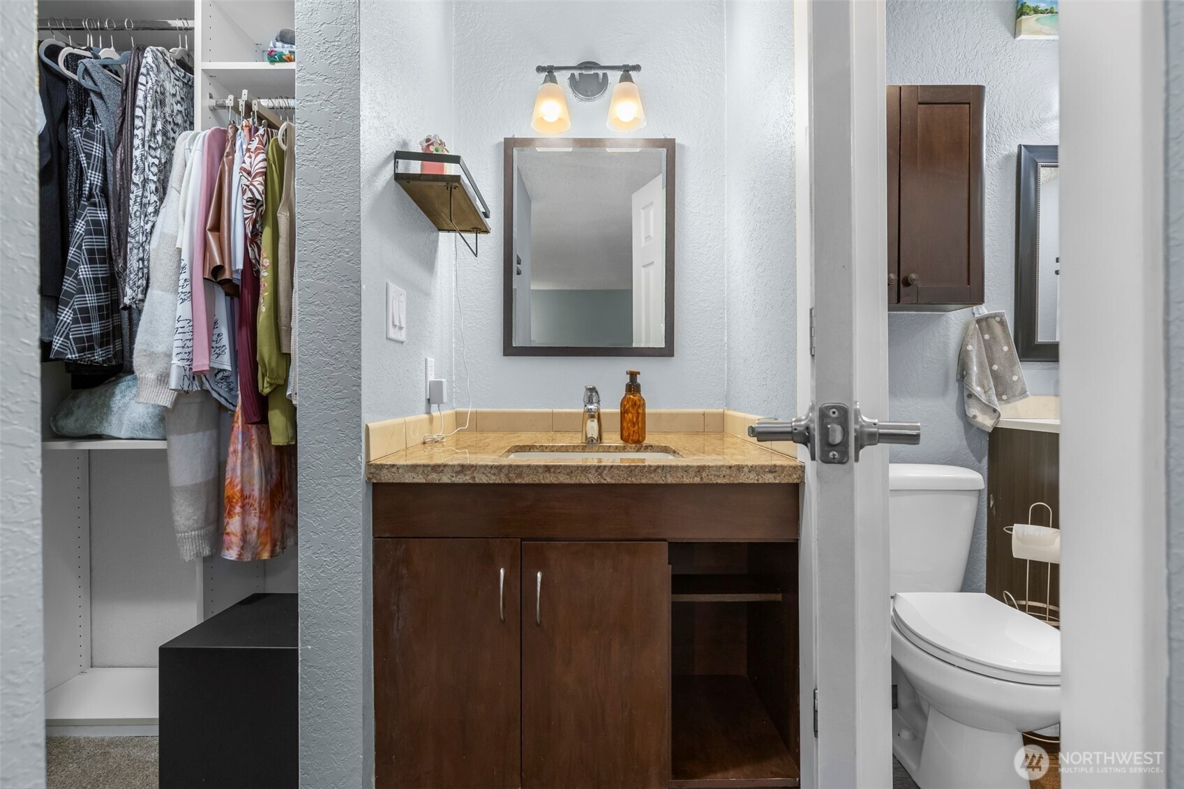 157 South 330th Street, Unit A Federal Way, WA 98003 - Photo 17 of 21 a bathroom with a sink vanity toilet and shower