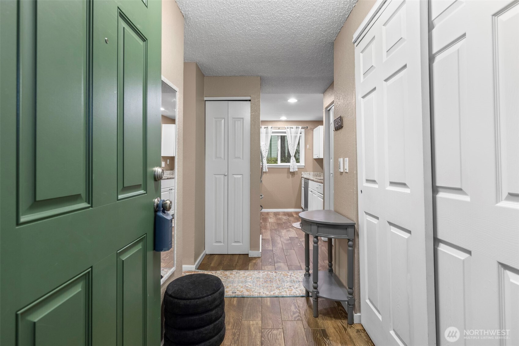 157 South 330th Street, Unit A Federal Way, WA 98003 - Photo 2 of 21 a kitchen with stainless steel appliances granite countertop cabinets and a refrigerator