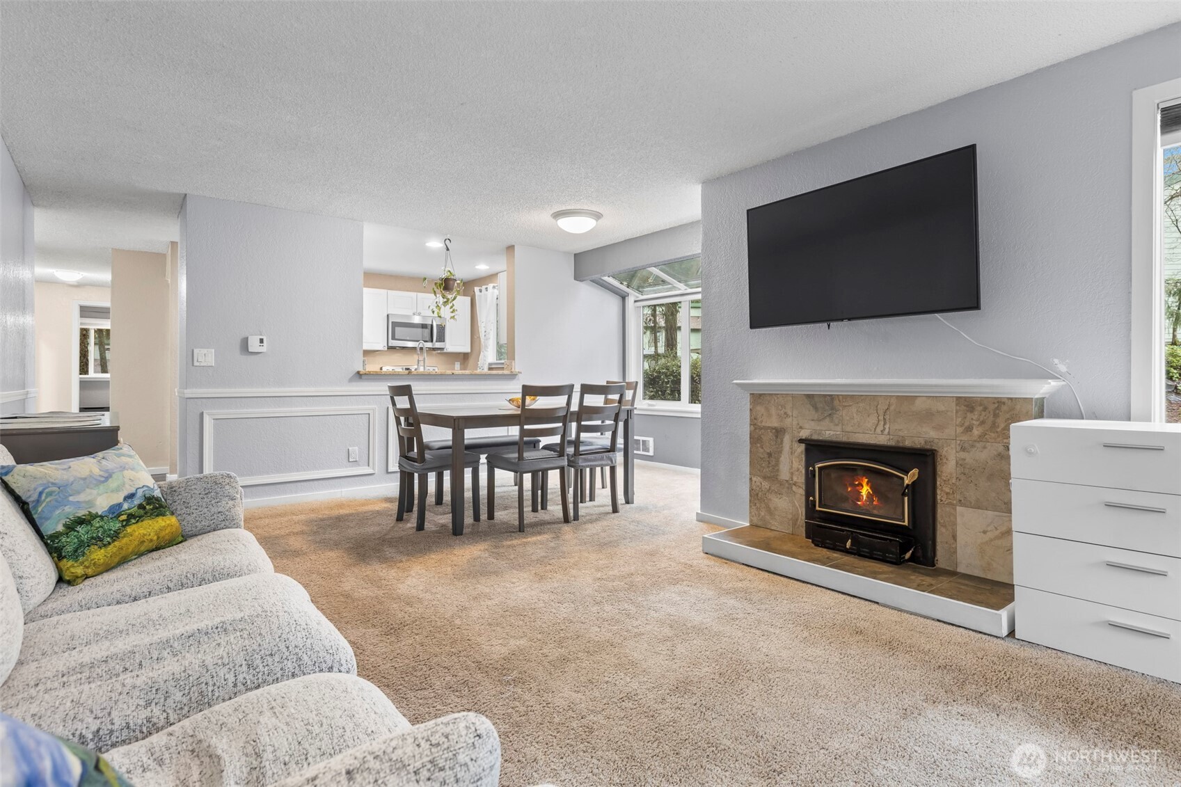 157 South 330th Street, Unit A Federal Way, WA 98003 - Photo 8 of 21 a living room with furniture a flat screen tv and a fireplace