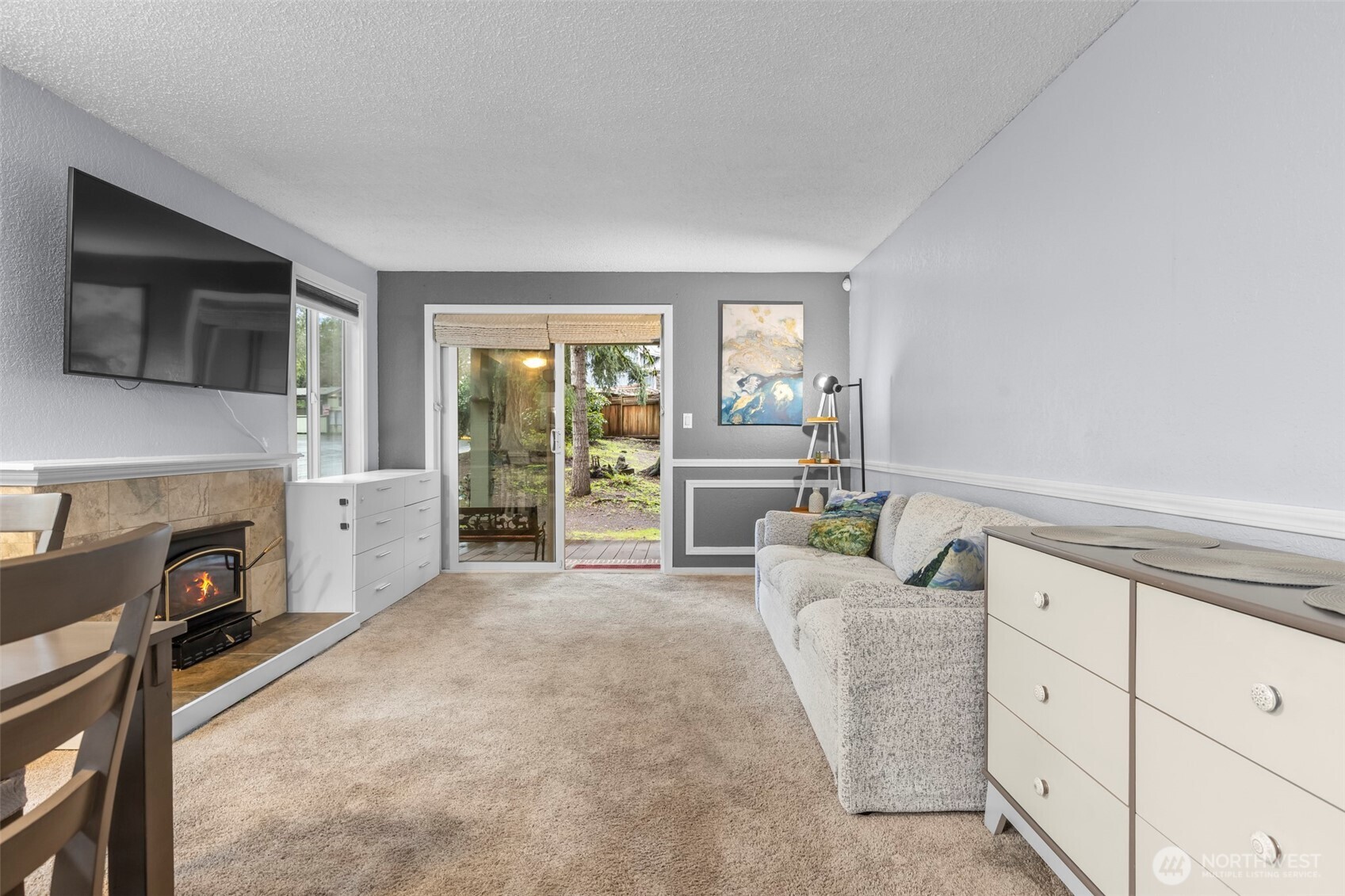 157 South 330th Street, Unit A Federal Way, WA 98003 - Photo 9 of 21 a living room with furniture a fireplace and a flat screen tv
