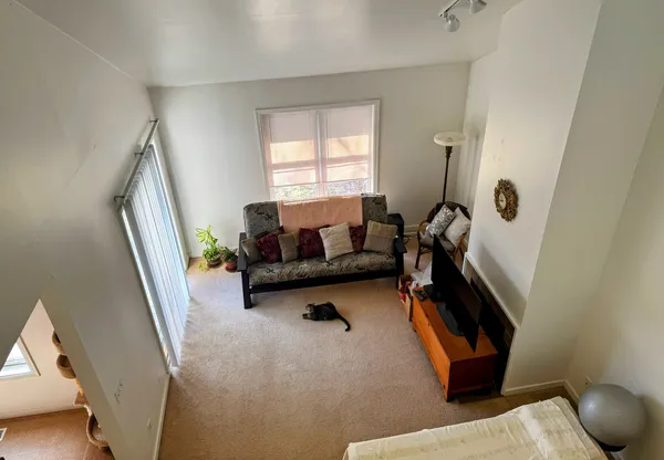 a living room with furniture and a window