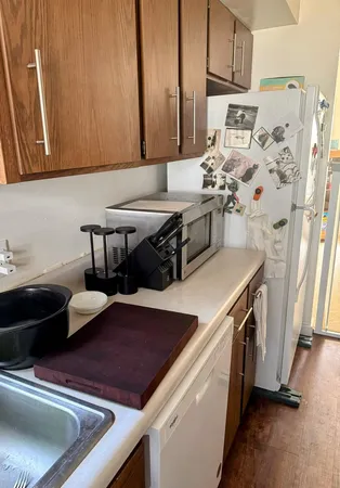 a kitchen with stainless steel appliances a sink a stove and a refrigerator
