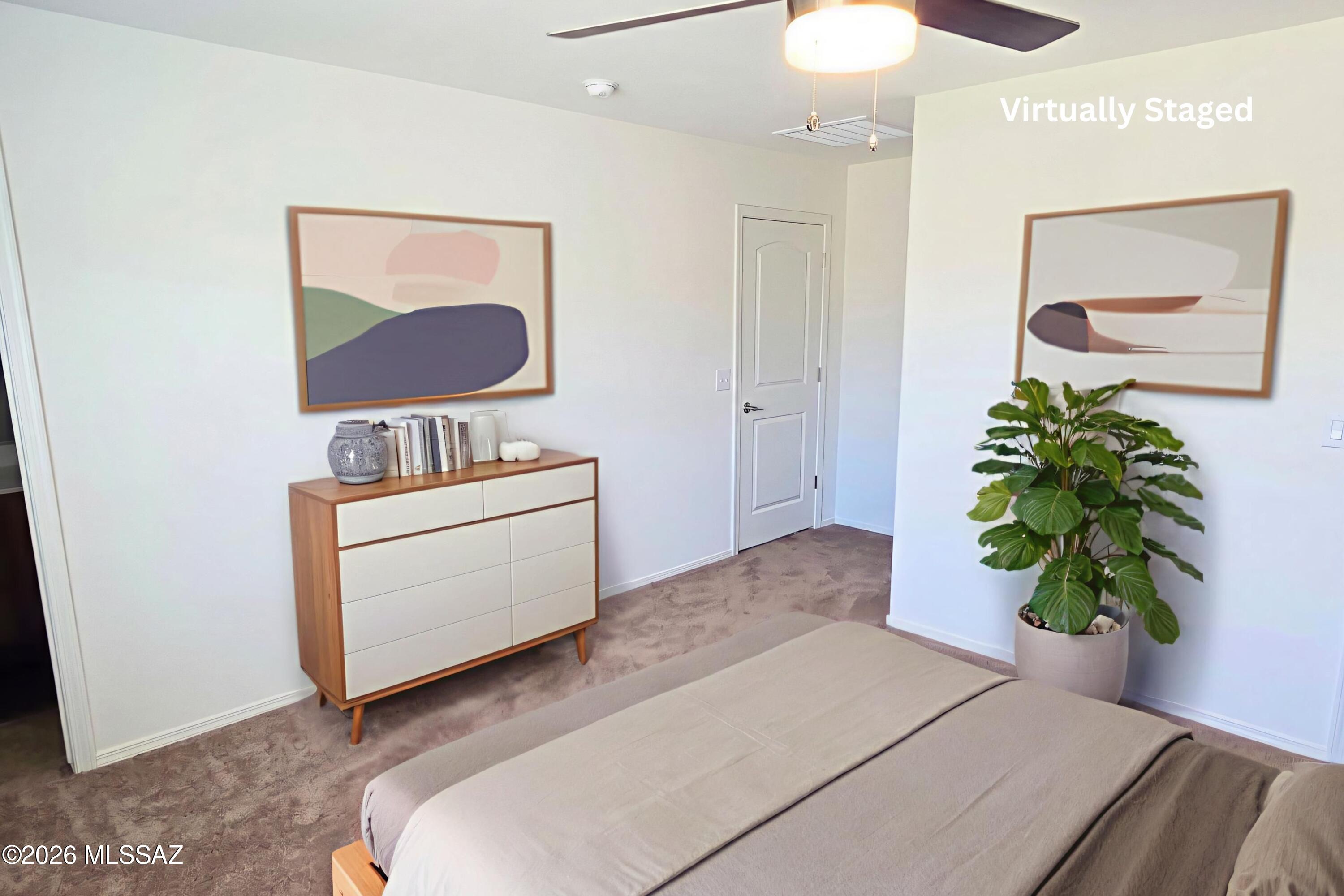 6343 South Rigby Way Tucson, AZ 85746 - Photo 19 of 29 a living room with furniture and a potted plant