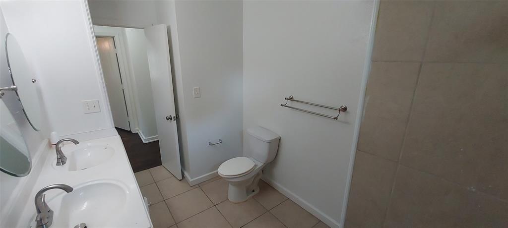 12202 Bellafonte Drive Dallas, TX 75243 - Photo 8 of 14 a bathroom with a sink and a toilet