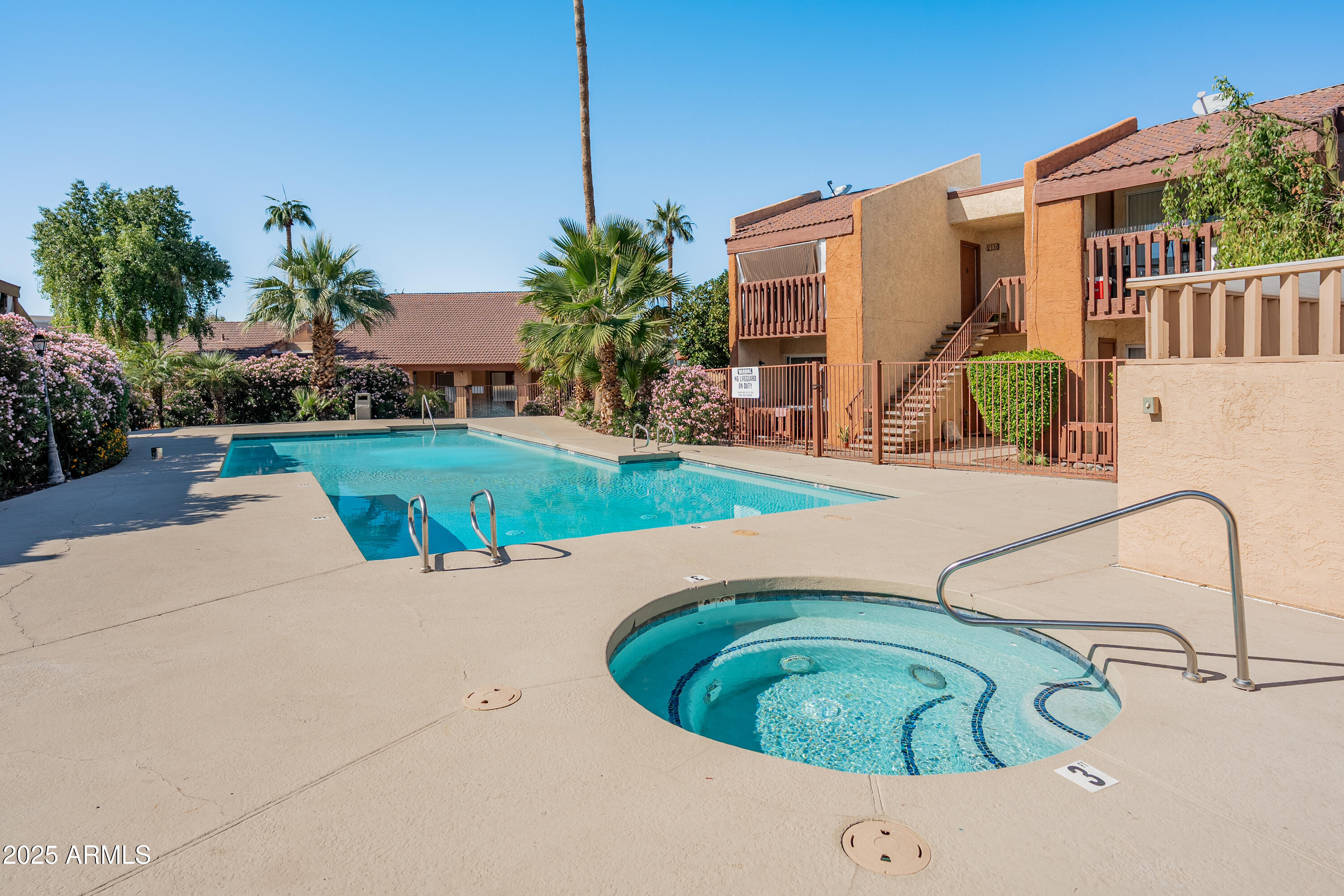 2121 West Royal Palm Road, Unit 1013 Phoenix, AZ 85021 - Photo 19 of 20 a view of a house with backyard and swimming pool
