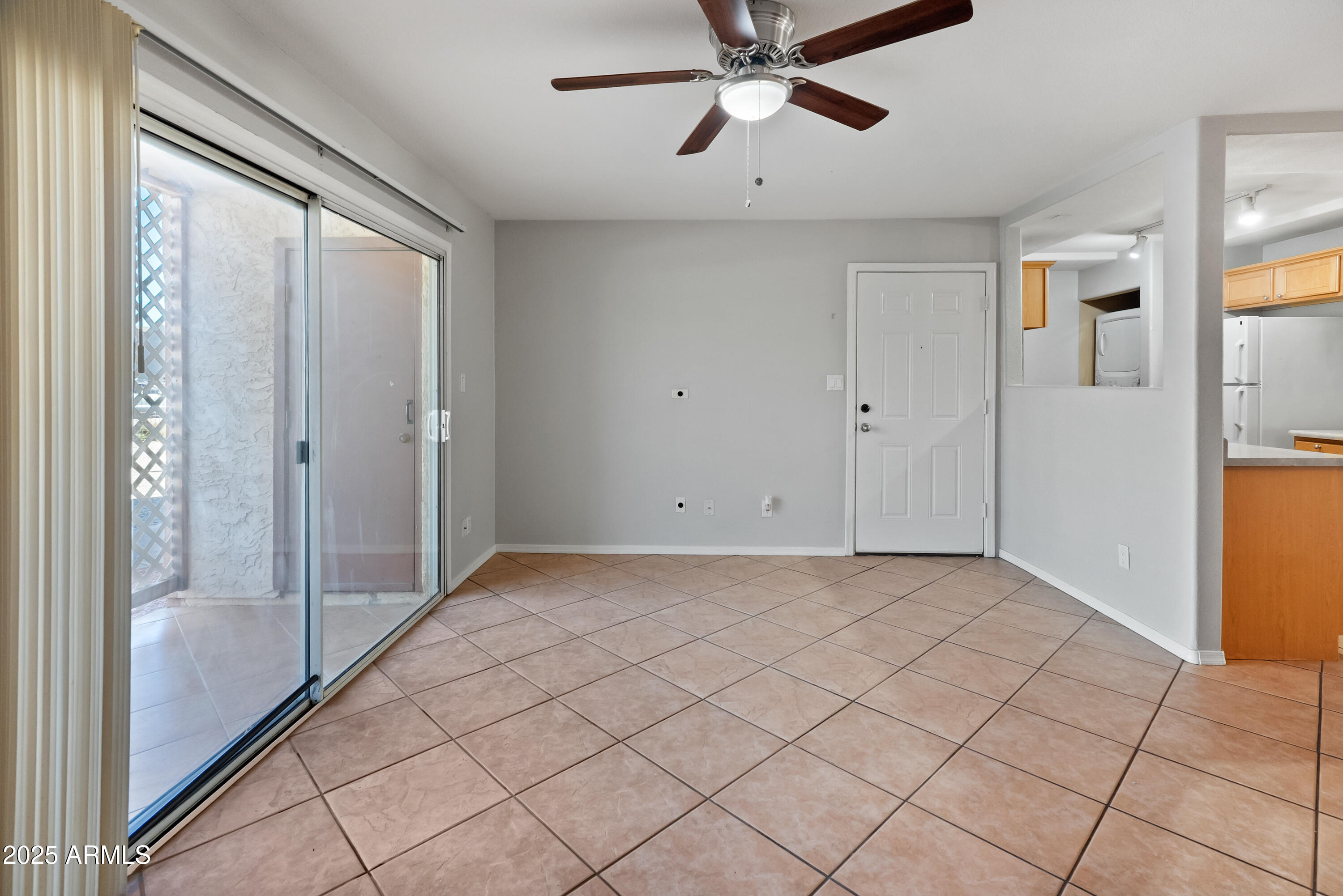 2121 West Royal Palm Road, Unit 1013 Phoenix, AZ 85021 - Photo 6 of 20 a view of an empty room and window