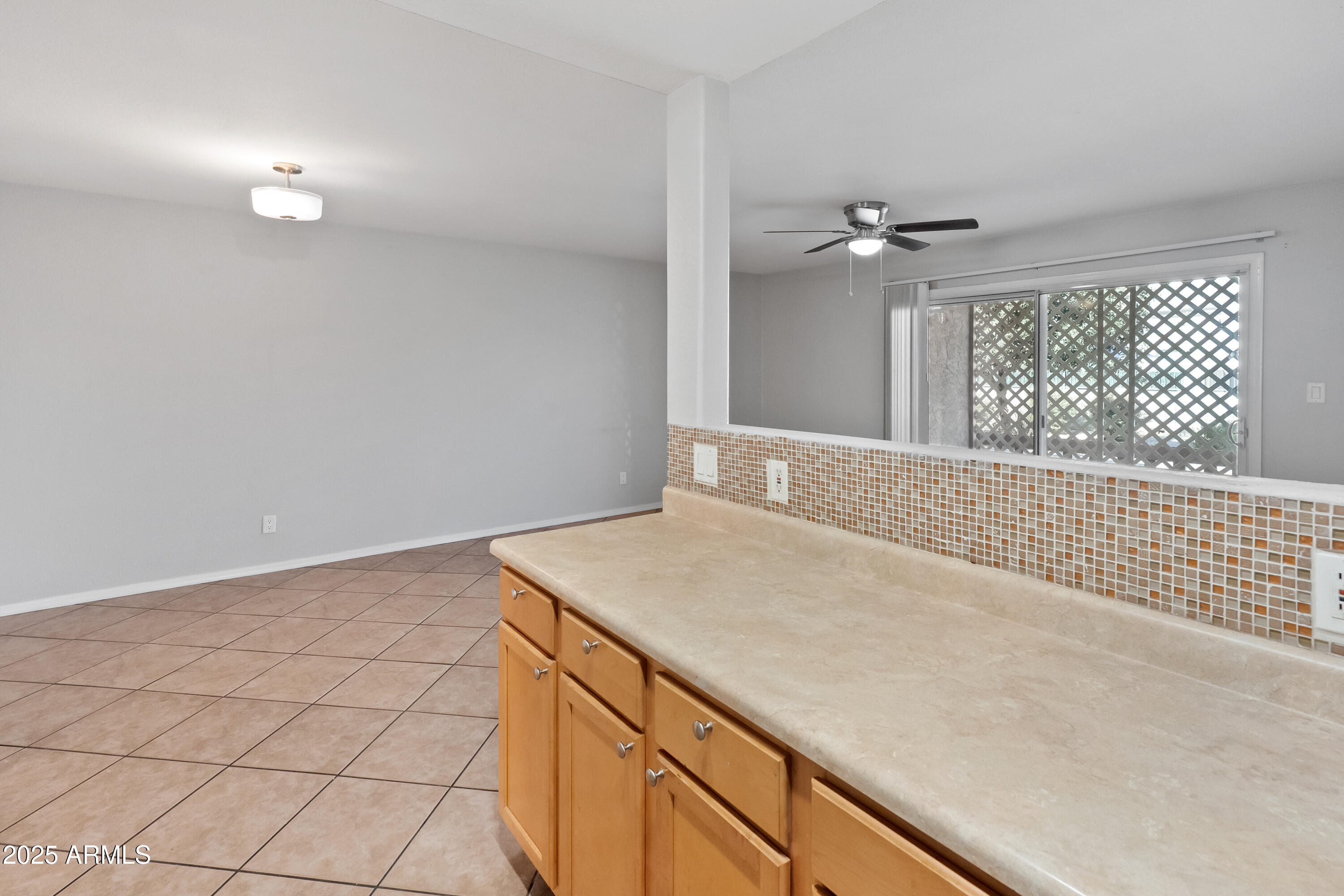 2121 West Royal Palm Road, Unit 1013 Phoenix, AZ 85021 - Photo 10 of 20 a view of a kitchen hallway with wooden floor