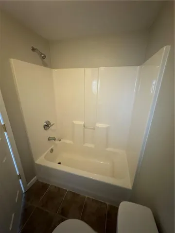 a bathroom with a bathtub and sink