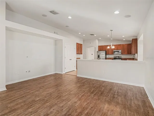a view of kitchen with wooden floor