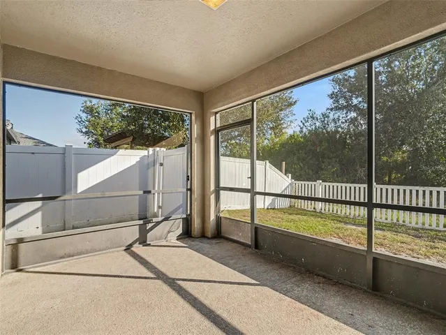 a view of a room with sliding door and wooden floor