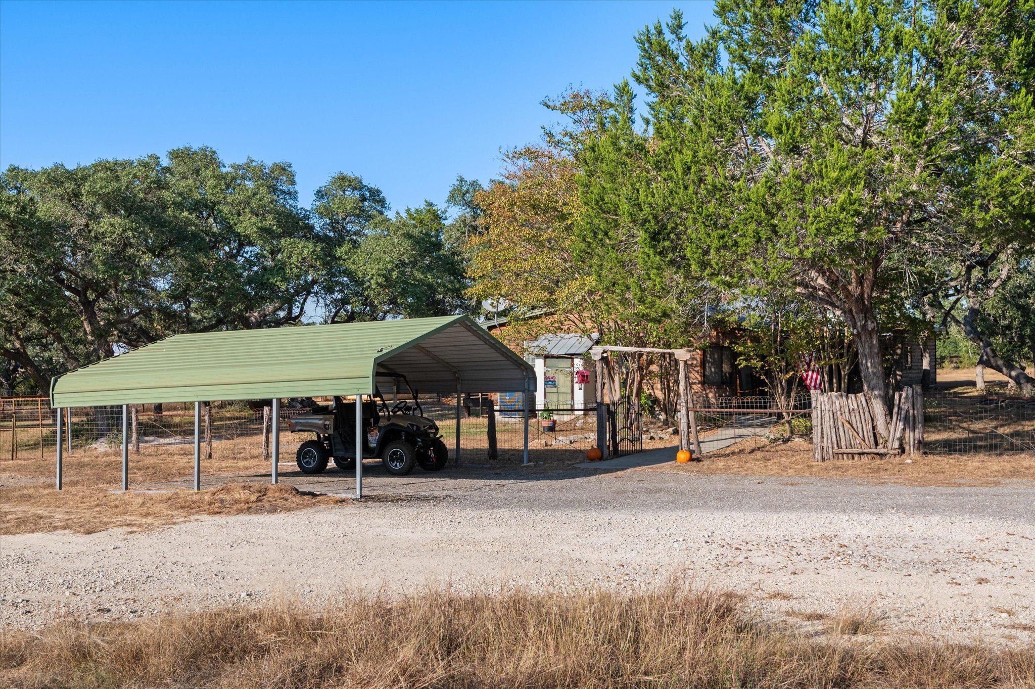 215 Go Away Road Blanco, TX 78606 - Photo 26 of 30 Detached car port and plenty of space for additional uncovered parking.