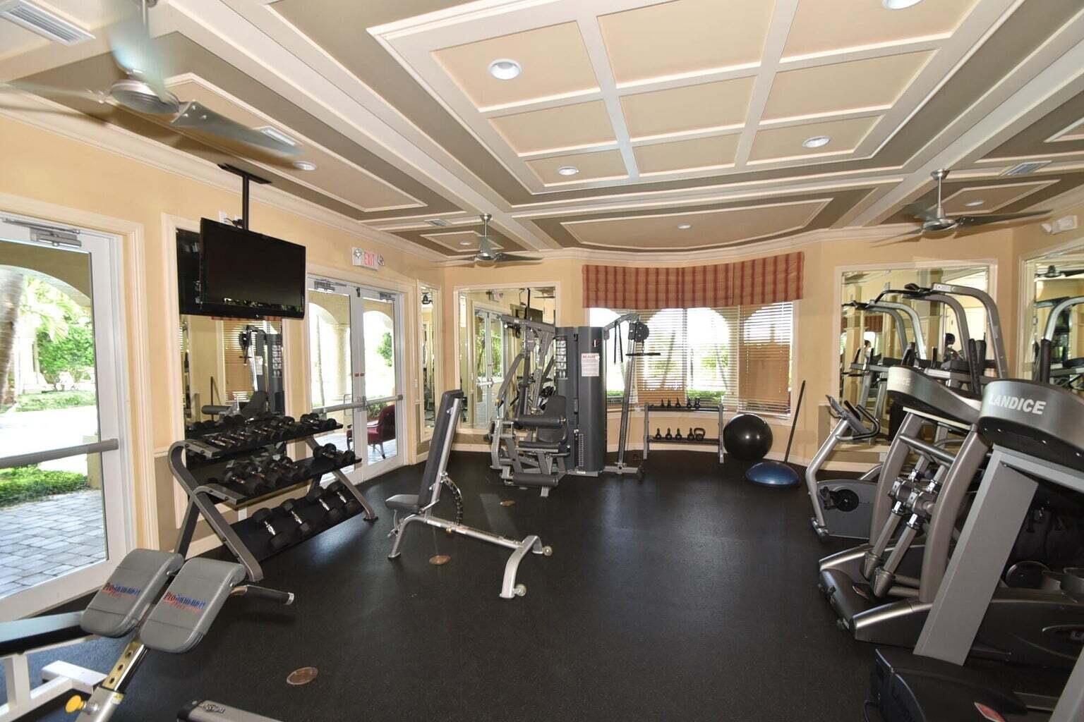 8679 Cobblestone Point Circle Boynton Beach, FL 33472 - Photo 27 of 31 a room with gym equipment and a large window