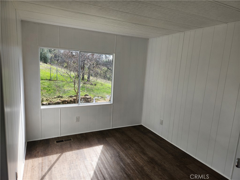 356 Chinese Wall Road Oroville, CA 95966 - Photo 21 of 30 wooden floor in an empty room with a window