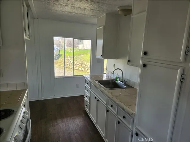 a kitchen with a sink and a window