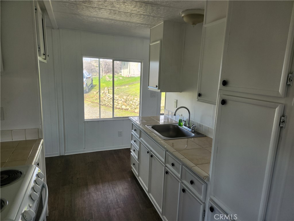 356 Chinese Wall Road Oroville, CA 95966 - Photo 26 of 30 a kitchen with a sink and a window