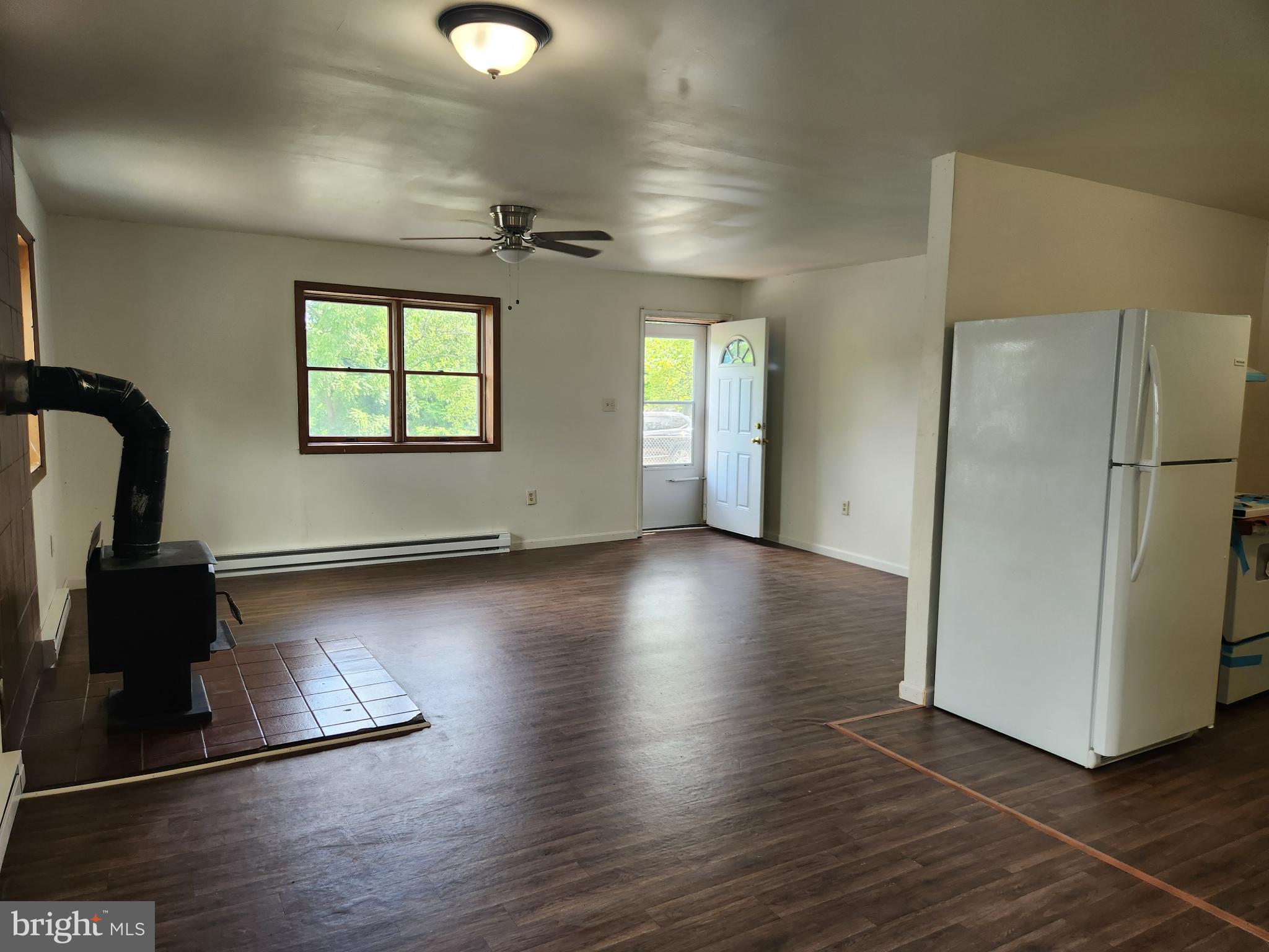 403 Rose Street Salisbury, MD 21801 - Photo 18 of 35 a view of a livingroom with wooden floor and a ceiling fan
