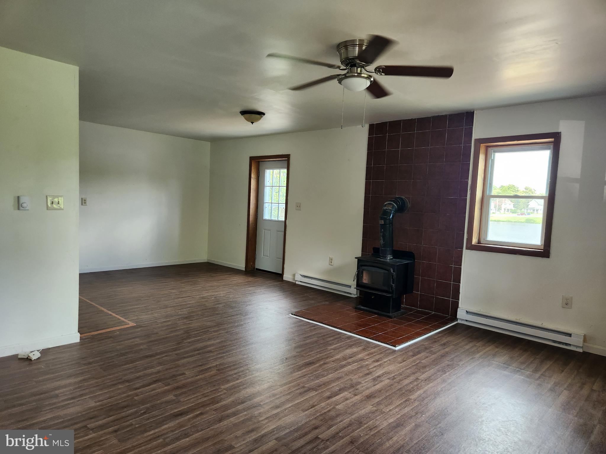403 Rose Street Salisbury, MD 21801 - Photo 19 of 35 an empty room with wooden floor and windows