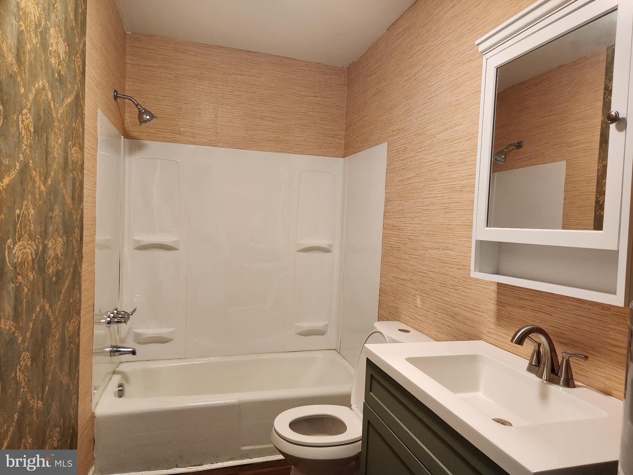 403 Rose Street Salisbury, MD 21801 - Photo 24 of 35 a bathroom with a sink toilet and shower