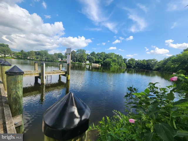 a view of a lake with a house in the background