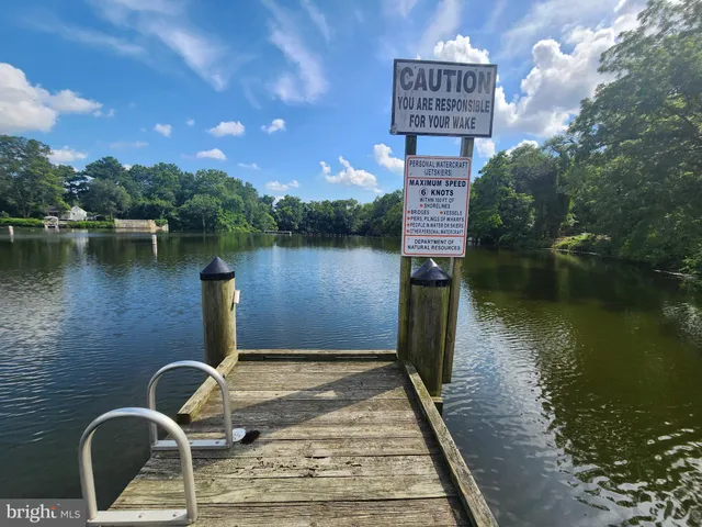 a front view of a house with a lake view