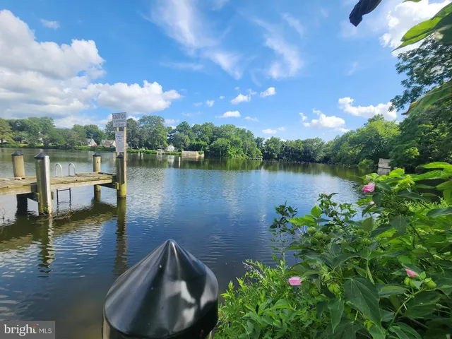 a view of a lake with a house in the background