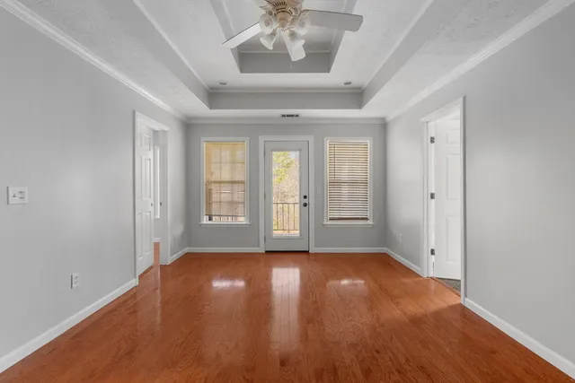 wooden floor in an empty room with a window