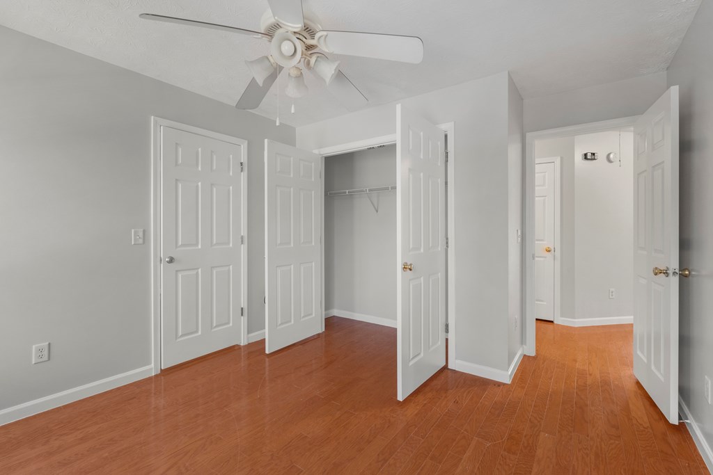 8016 Glen Valley Drive Midland, GA 31820 - Photo 22 of 31 an empty room with closet and a chandelier fan