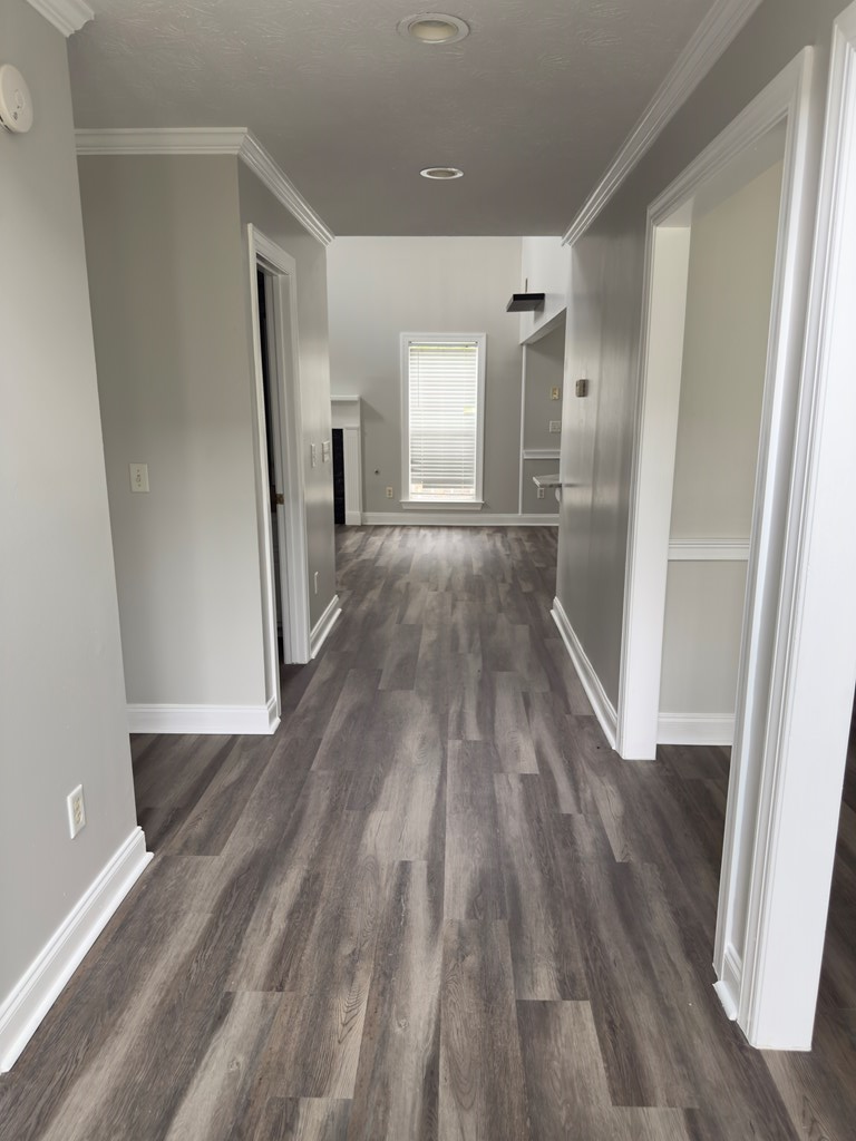 8016 Glen Valley Drive Midland, GA 31820 - Photo 3 of 31 a view of a hallway with wooden floor and staircase
