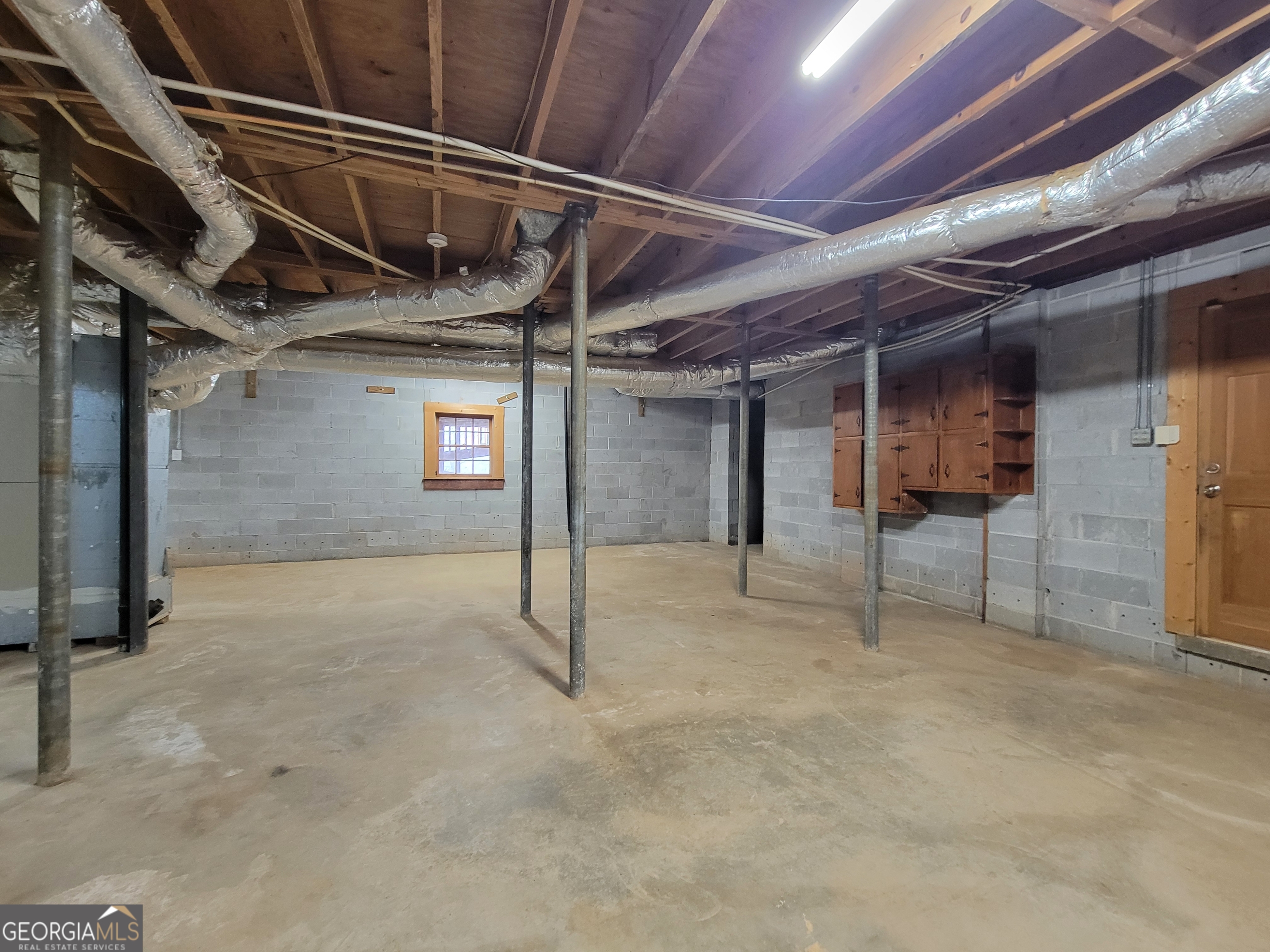 788 Harrison Mill Road Winder, GA 30680 - Photo 17 of 19 a view of an empty room with wooden roof