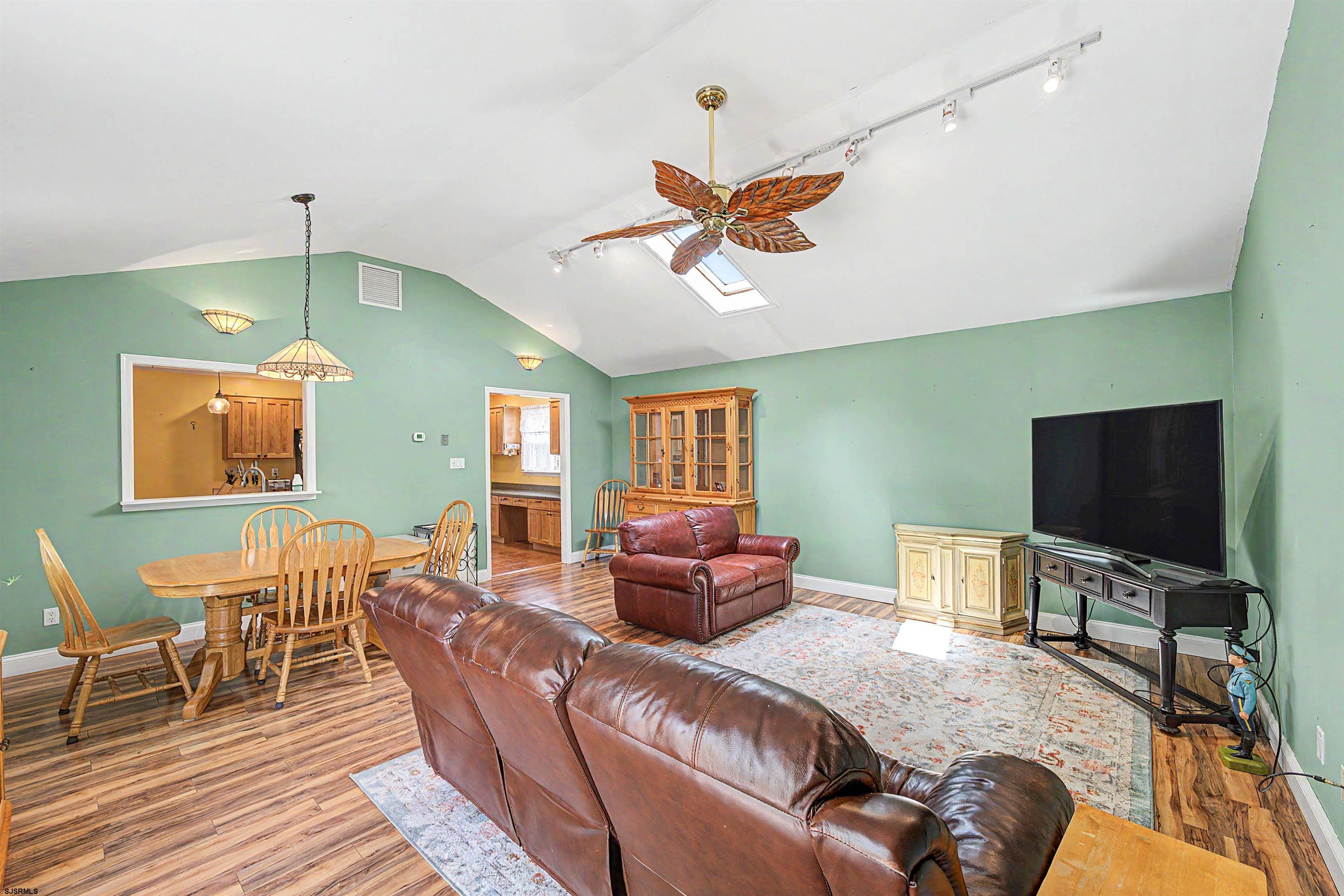 125 Exton Road Somers Point, NJ 08244 - Photo 17 of 35 a living room with furniture and a flat screen tv