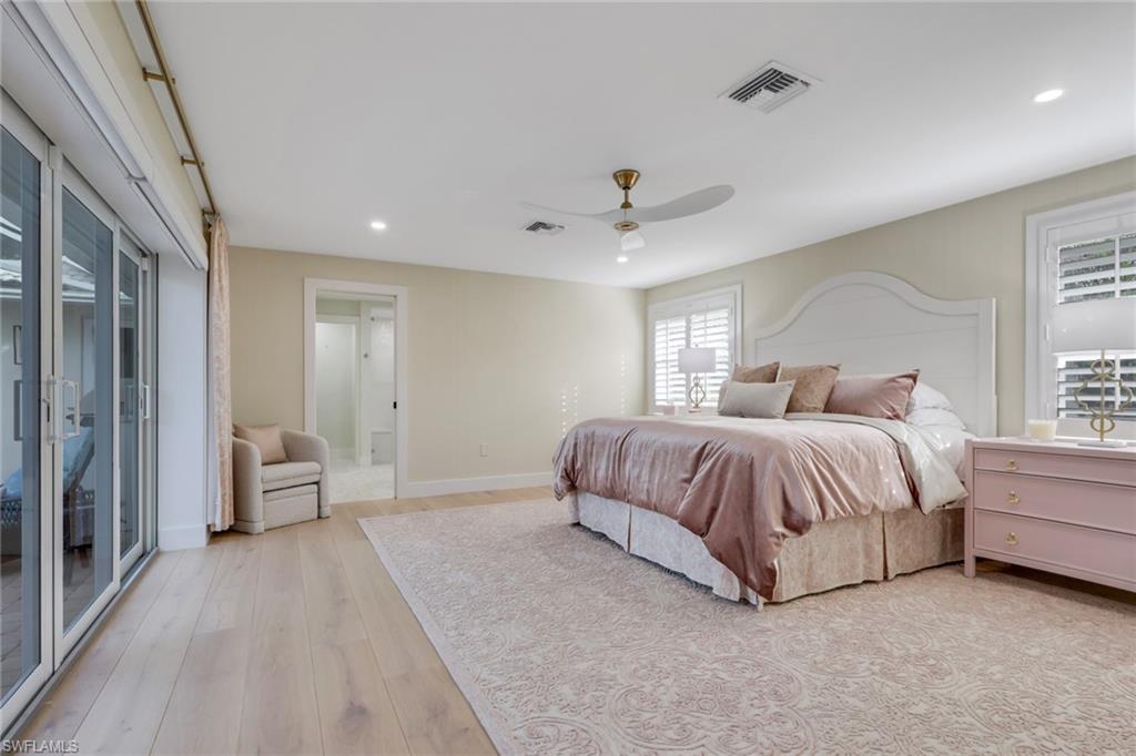 695 Regatta Road Naples, FL 34103 - Photo 13 of 43 Bedroom with access to exterior, recessed lighting, a ceiling fan, and light wood-style floors