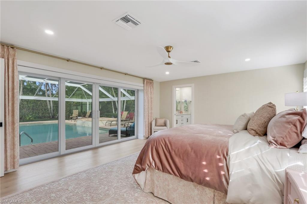 695 Regatta Road Naples, FL 34103 - Photo 14 of 43 Bedroom with wood finished floors, access to outside, recessed lighting, ceiling fan, and a sunroom